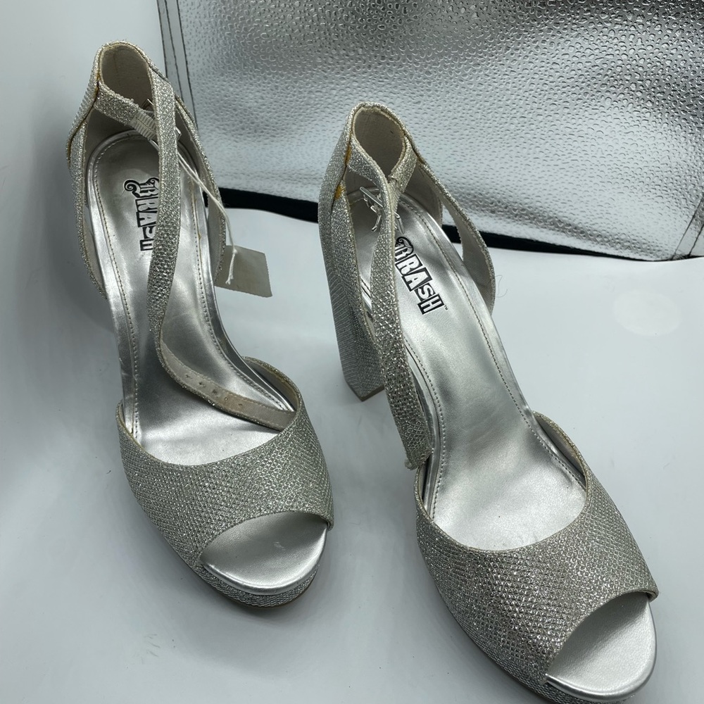Trash silver platform pumps size 8.5